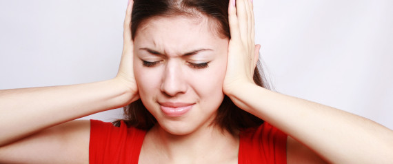 The girl closes ears. 1